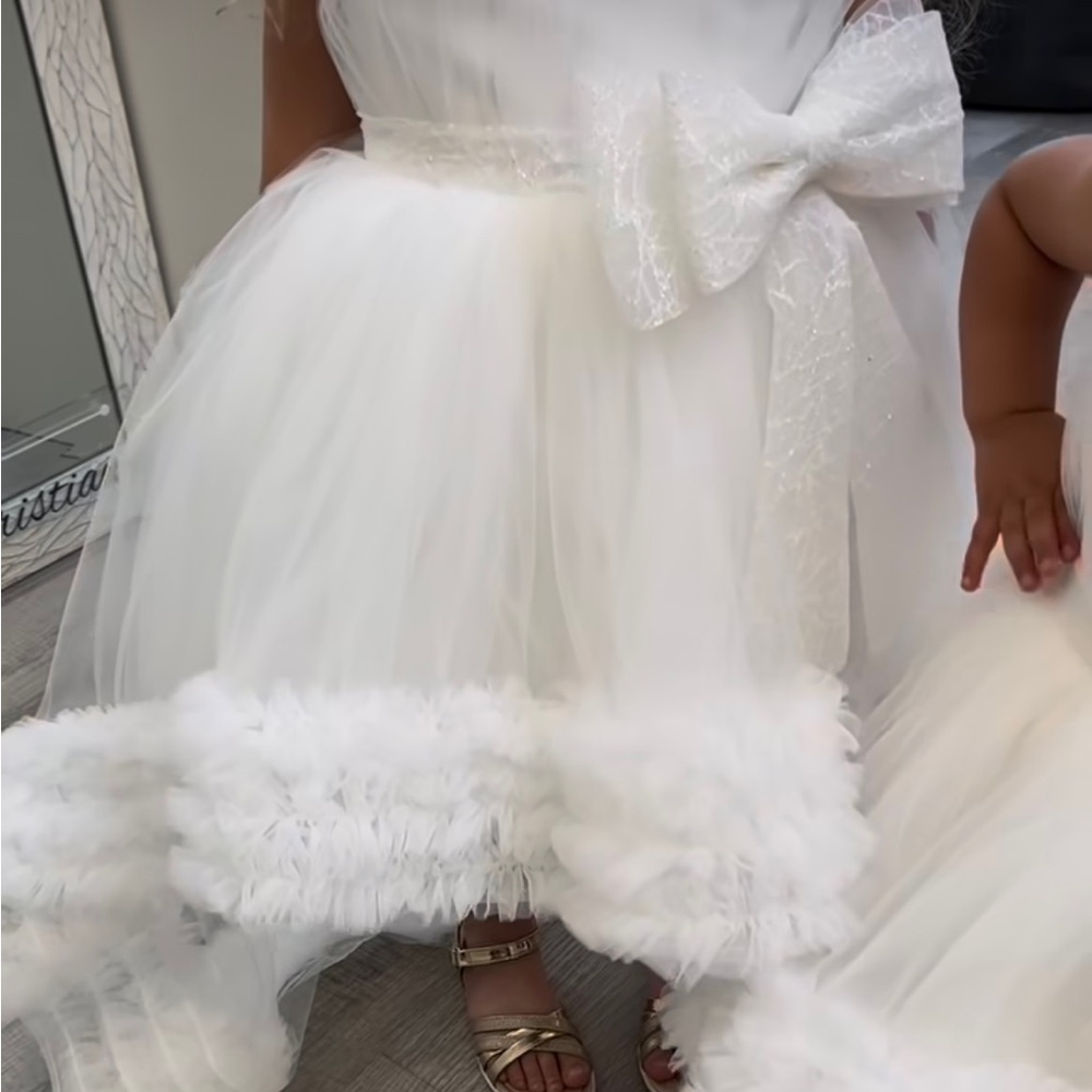 Custom made flower girl high low dress. Has a train in the back